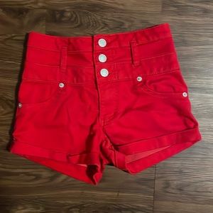 bright red high-waisted shorts